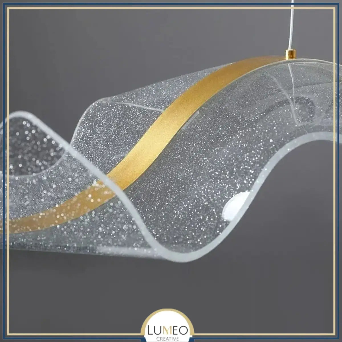 Suspension ondulante LED dorée