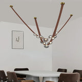 Lustre suspendu design à sangles de cuir et globes en verre