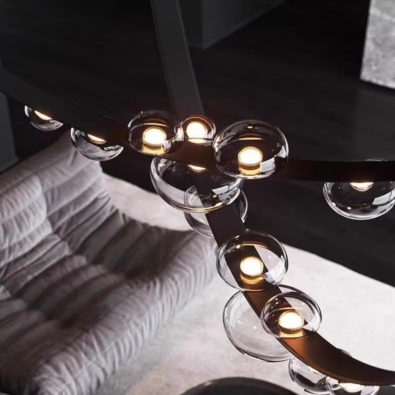 Lustre suspendu design à sangles de cuir et globes en verre