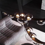 Lustre suspendu design à sangles de cuir et globes en verre