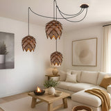 Suspension bois sculpté en forme de pomme de pin | Chic & naturel