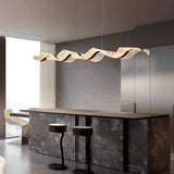 Suspension ondulante LED dorée