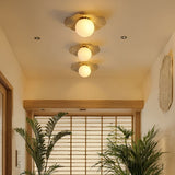 Plafonnier en cuivre et boule de verre opalin | Plafonnier lotus