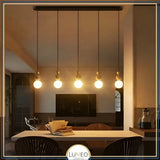 suspension design en pierre bois et verre dépoli opale salle à manger, ilot et salon